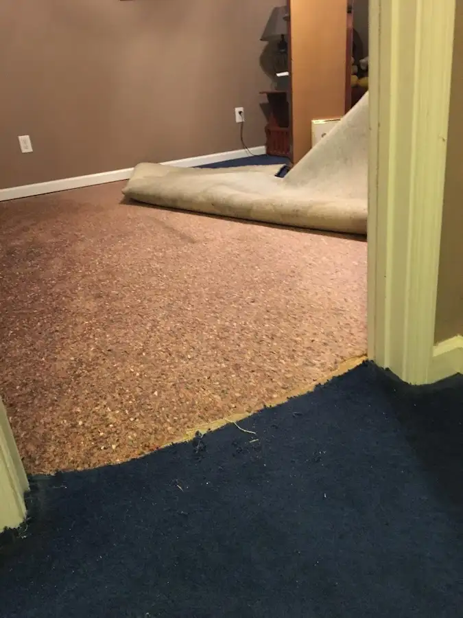 Carpet pad removal revealing water damage during Drying & Dehumidification in Sierra Vista Southeast